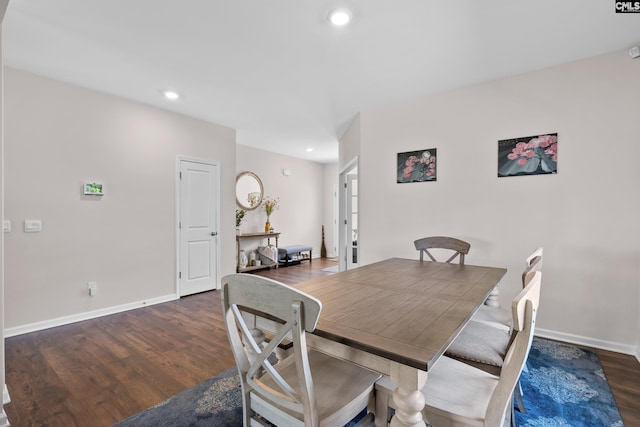 dining space with dark wood-type flooring