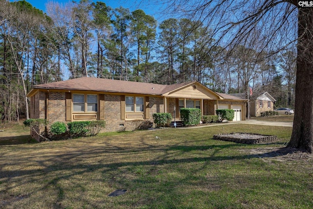 ranch-style home featuring a front yard and a garage