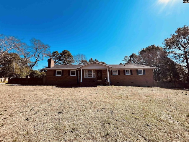 single story home featuring a front lawn