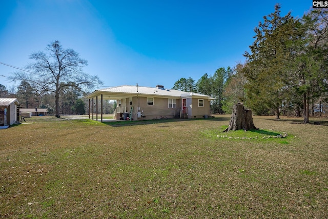 rear view of property with a yard