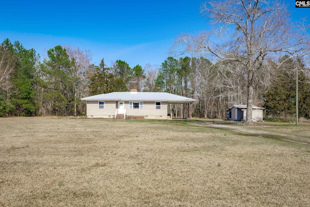 rear view of house with a yard