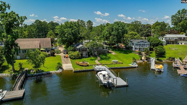 view of dock featuring a yard and a water view