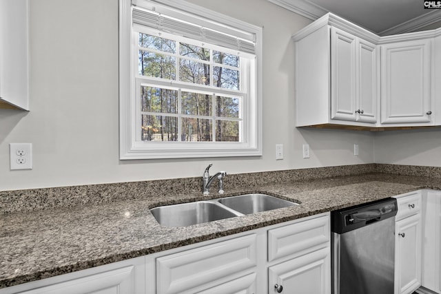 kitchen featuring dark stone countertops, white cabinetry, sink, and stainless steel dishwasher