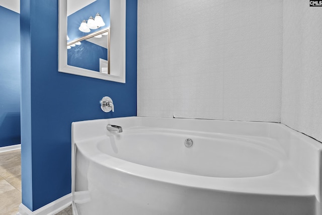 bathroom featuring a washtub