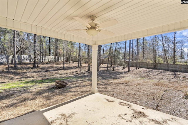 view of yard with ceiling fan and a patio area