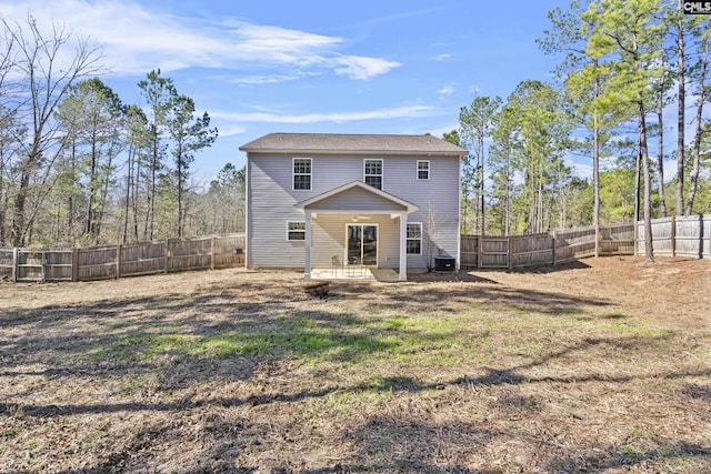 back of property featuring a yard