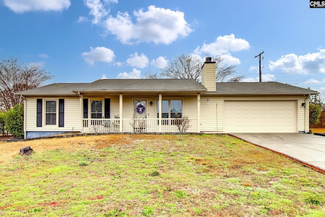 ranch-style home with covered porch, a front yard, and a garage