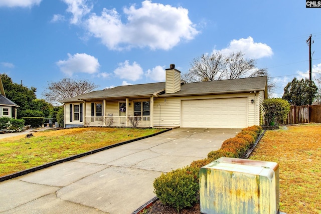 ranch-style home with covered porch, a garage, and a front lawn