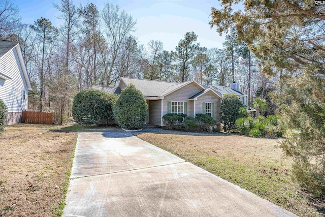 ranch-style home with a front lawn