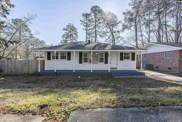 ranch-style home featuring a front lawn, central AC, and a porch