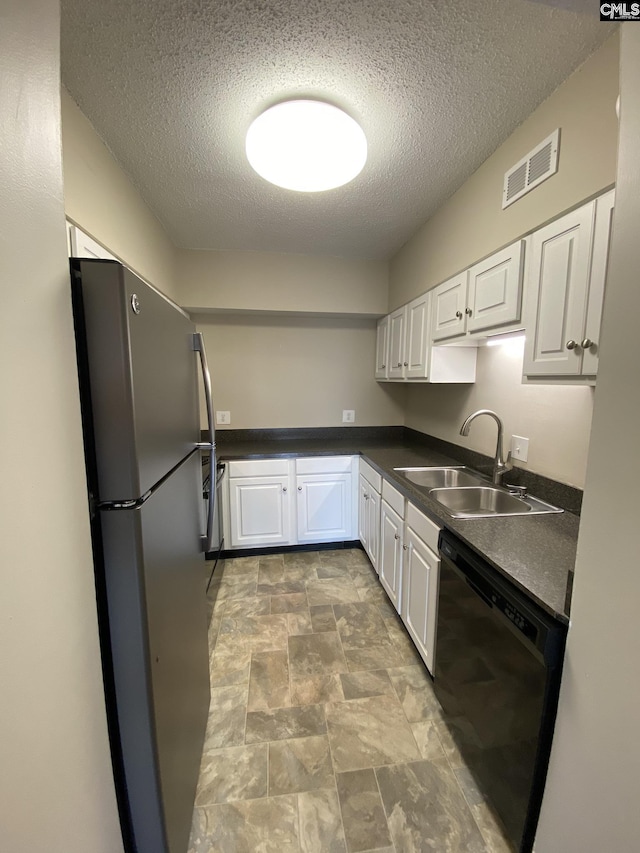 kitchen with white cabinetry, a textured ceiling, stainless steel refrigerator, sink, and black dishwasher