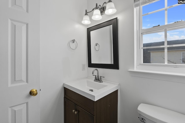 bathroom with toilet and vanity