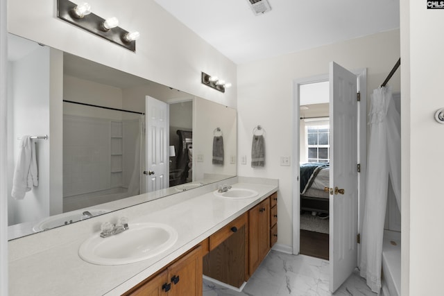 bathroom featuring vanity and shower / bathtub combination with curtain