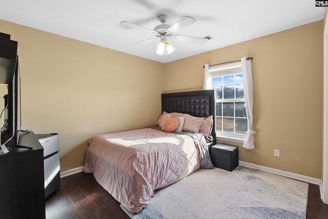 bedroom with ceiling fan and dark hardwood / wood-style floors