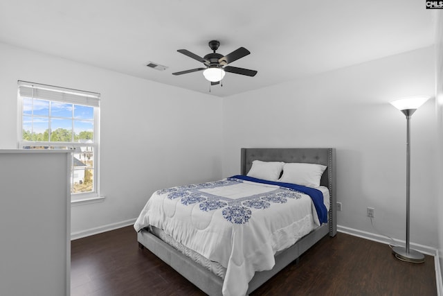 bedroom featuring ceiling fan and dark hardwood / wood-style flooring