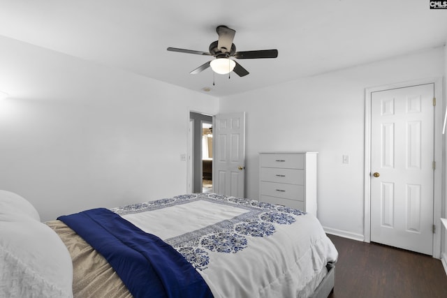 bedroom featuring dark hardwood / wood-style flooring and ceiling fan