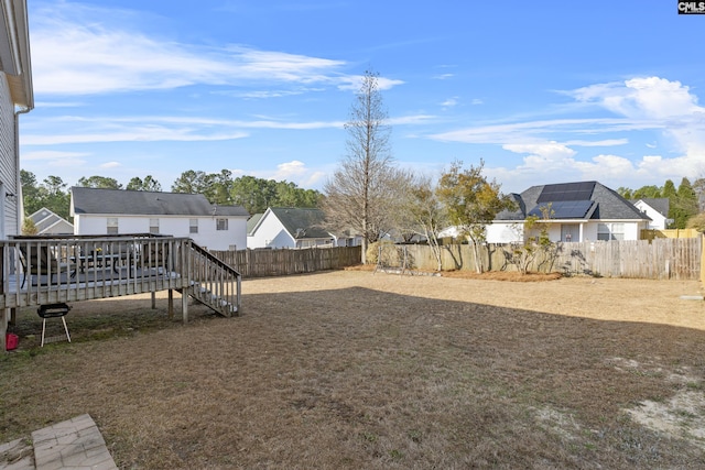 view of yard featuring a wooden deck