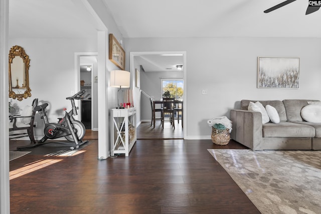 living room with ceiling fan and dark hardwood / wood-style floors