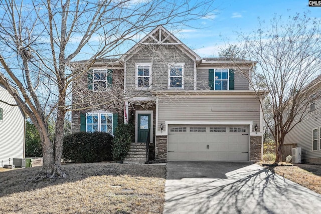 craftsman-style home featuring central AC, ac unit, and a garage