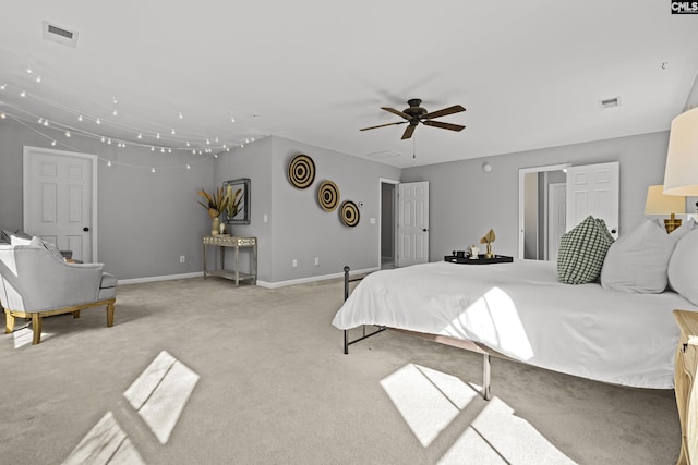 bedroom with light carpet and ceiling fan