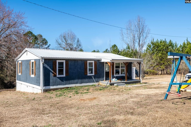 view of front of property with a front yard and a porch