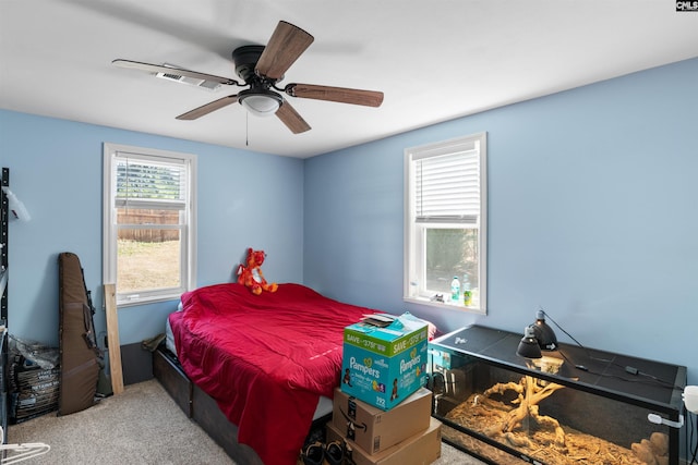 carpeted bedroom with ceiling fan