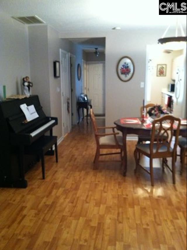 dining space featuring light wood-type flooring