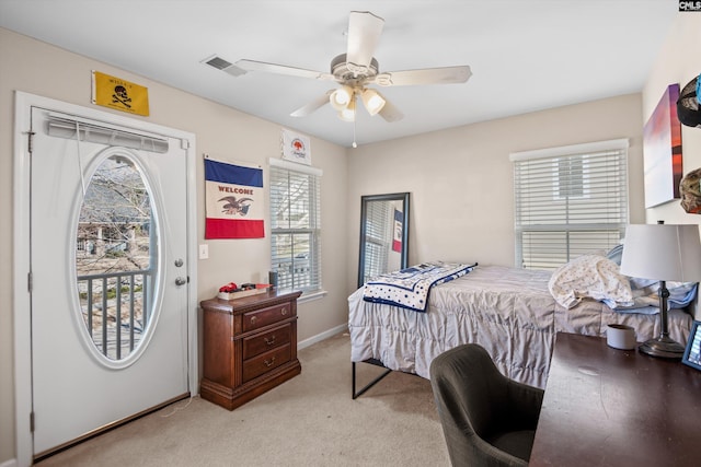 bedroom featuring ceiling fan, access to exterior, and light colored carpet