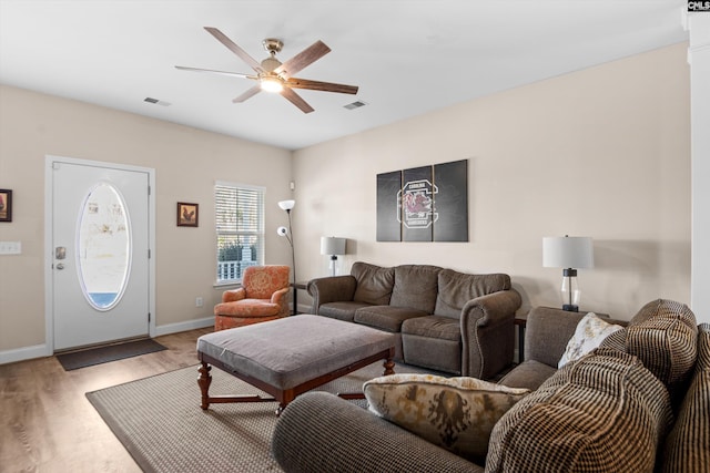 living room with ceiling fan and wood-type flooring