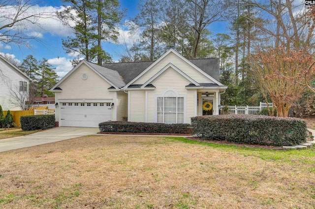 view of front of property with a front lawn and a garage