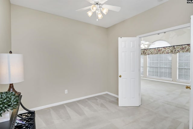 unfurnished bedroom featuring ceiling fan and light colored carpet