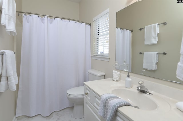 bathroom with toilet and vanity