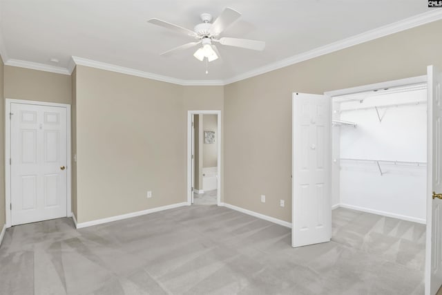 unfurnished bedroom with ornamental molding and light colored carpet