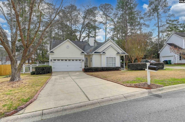 view of front facade with a front lawn and a garage