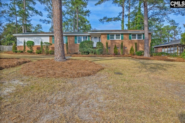 ranch-style house with a front lawn