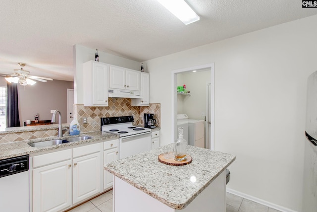 kitchen with white electric stove, dishwashing machine, white cabinets, sink, and washer and dryer