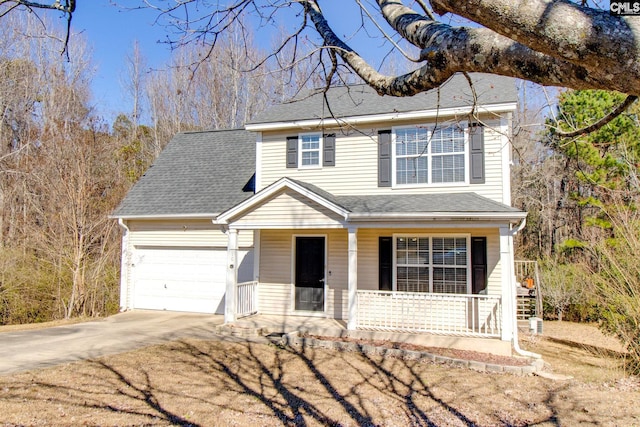 view of front of house with a porch and a garage