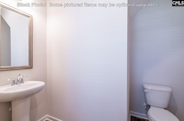 bathroom featuring sink and toilet