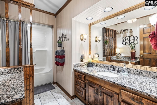 bathroom featuring ornamental molding, tile patterned flooring, vanity, and shower / bathing tub combination