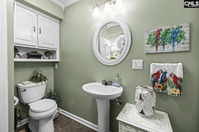 bathroom with sink, tile patterned flooring, and toilet