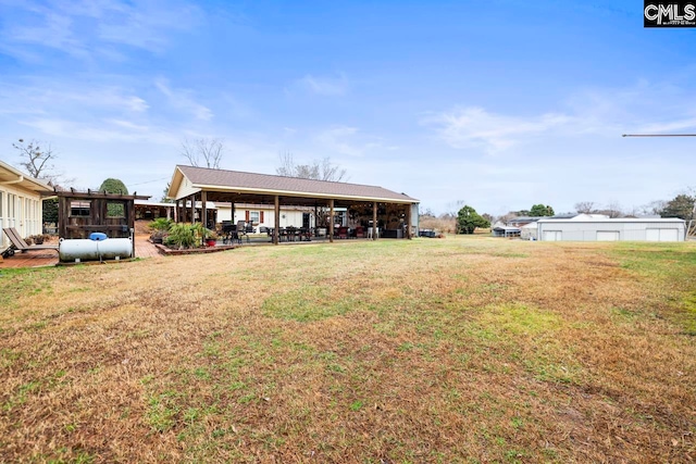 back of house with a lawn