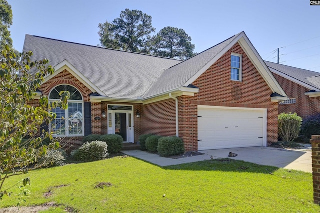 view of front of home featuring a front yard and a garage