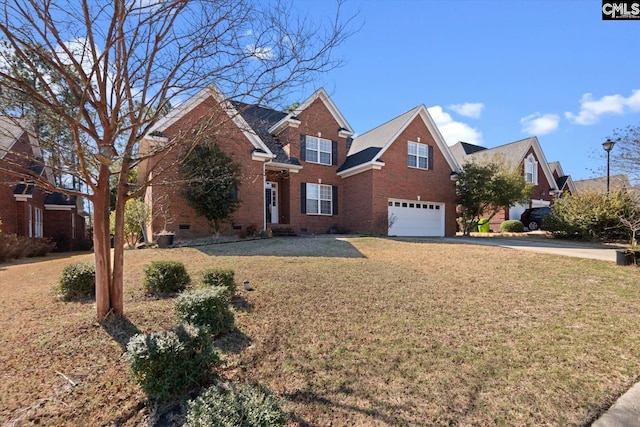 view of front property featuring a front yard and a garage