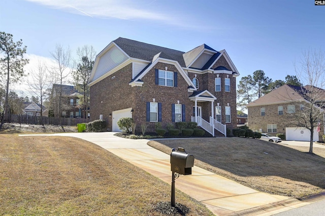 view of front of home featuring a front lawn and a garage