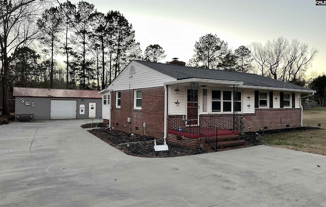 view of front of home with an outbuilding and a garage