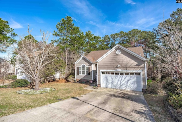 view of front of home with a garage and a front yard