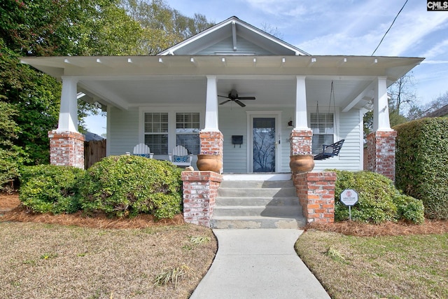 view of front of property featuring ceiling fan and a porch