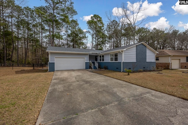 ranch-style home with a garage and a front yard