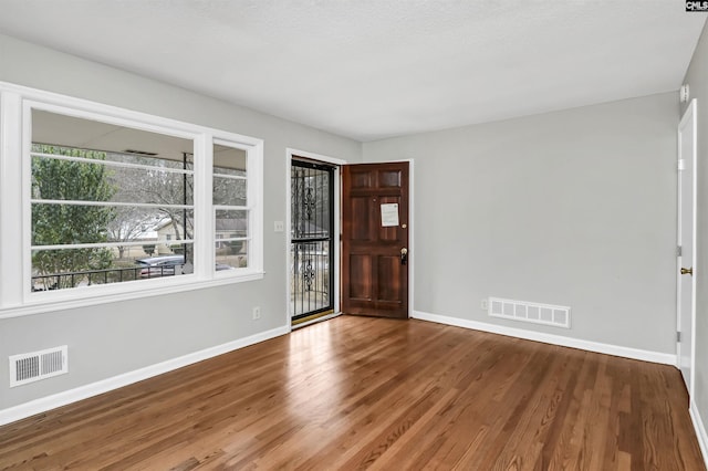 entrance foyer featuring hardwood / wood-style floors