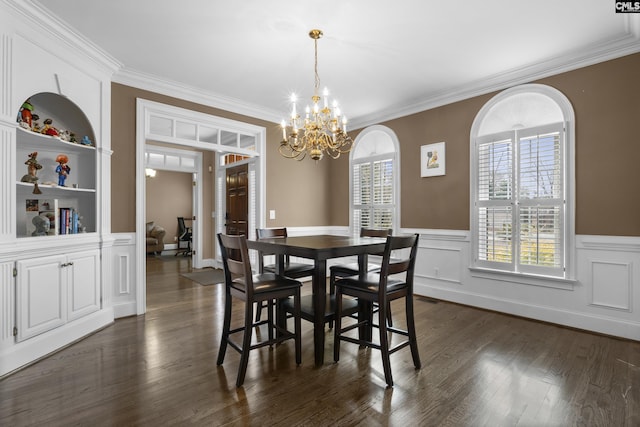 345 Amstar Rd, Columbia, SC 29212 - dining room with ornamental molding, a chandelier, a wainscoted wall, and dark wood-style flooring